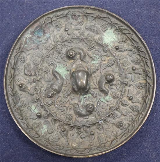 A Chinese bronze mirror 11cm diameter